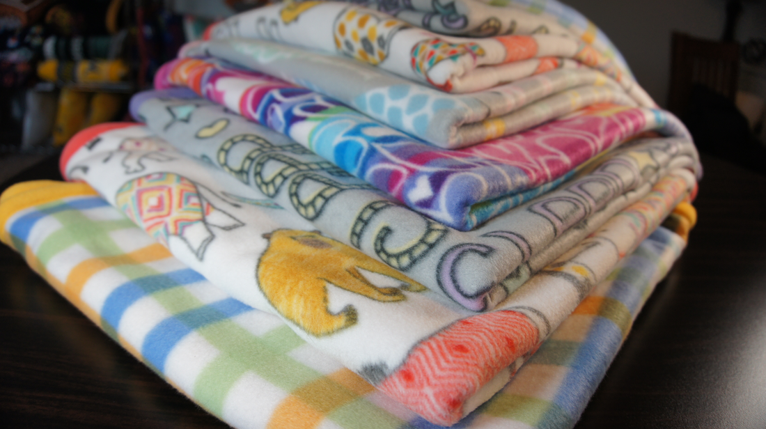 Fleece Centric - Baby Blankets and Lovies - stack of folded baby blankets